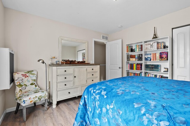 72597 Faye Ct, South Haven, MI 49090 - bedroom featuring wood finished floors and baseboards