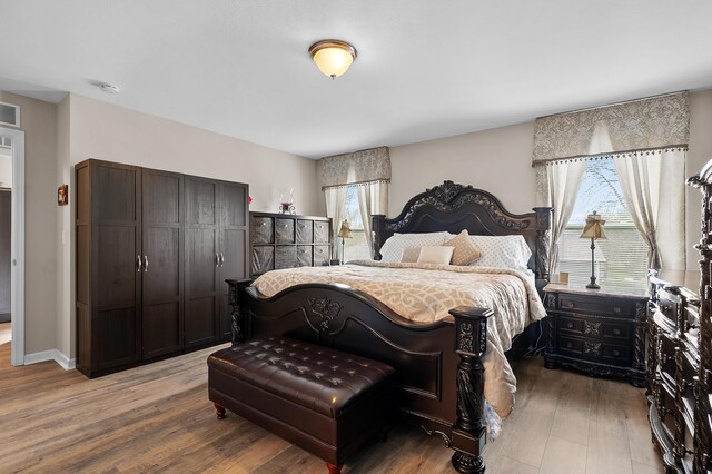 72597 Faye Ct, South Haven, MI 49090 - bedroom featuring wood finished floors and multiple windows