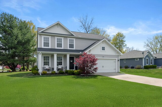 72597 Faye Ct, South Haven, MI 49090 - traditional home with board and batten siding, covered porch, driveway, and a front lawn