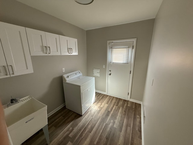 laundry room with washer / clothes dryer, dark wood-style flooring, baseboards, and cabinet space