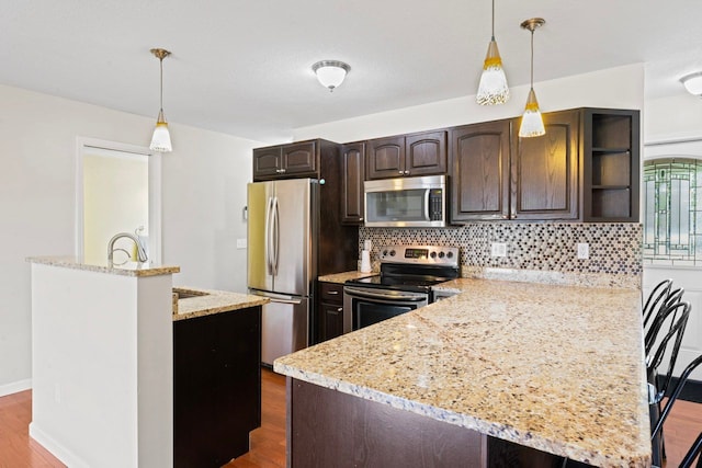 kitchen featuring stainless steel appliances, dark brown cabinets, tasteful backsplash, dark wood-style flooring, and open shelves