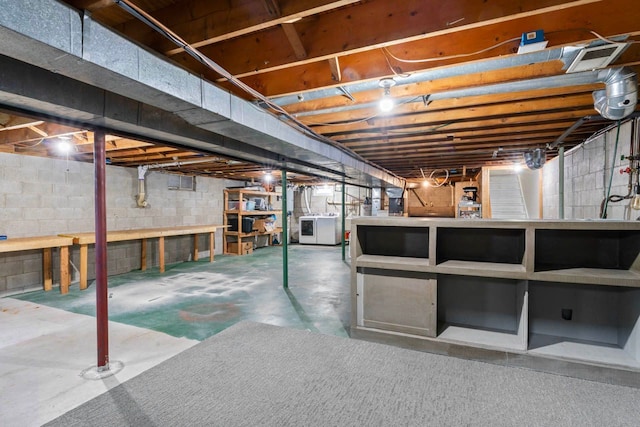 unfinished basement featuring washer / clothes dryer