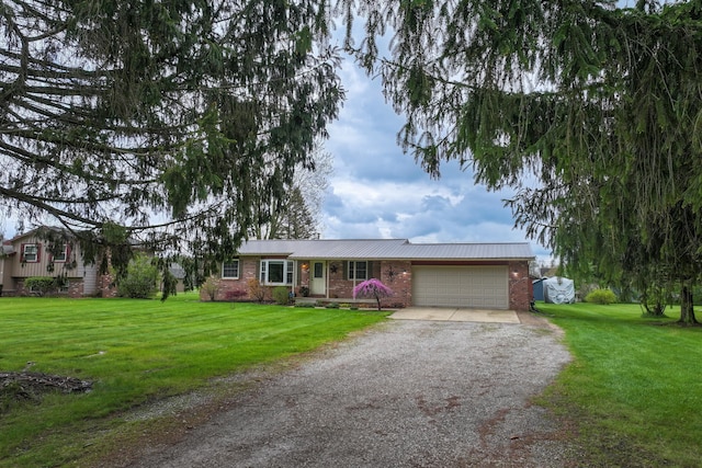 ranch-style home with driveway, an attached garage, brick siding, and a front yard