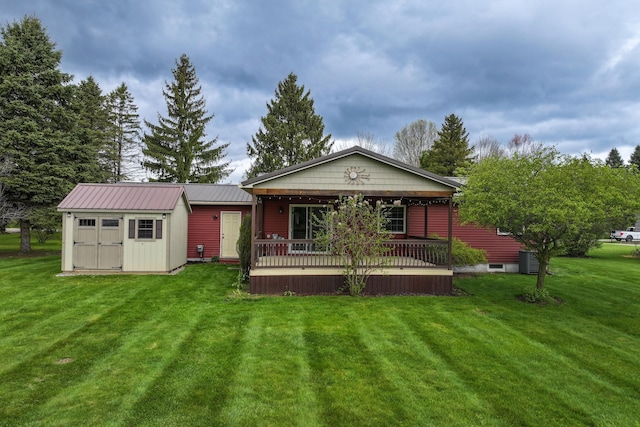 back of house with a lawn, a shed, an outdoor structure, cooling unit, and a deck