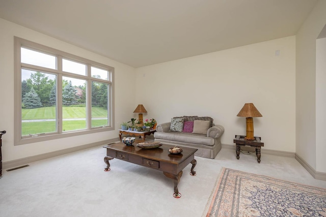 living area with carpet floors and baseboards