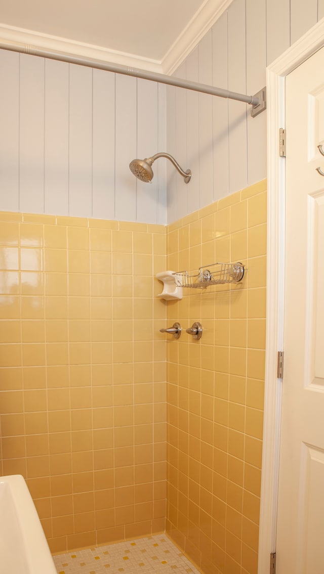 bathroom featuring a stall shower and ornamental molding