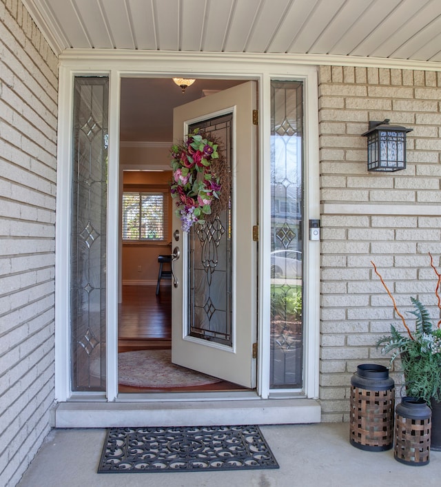 property entrance with brick siding