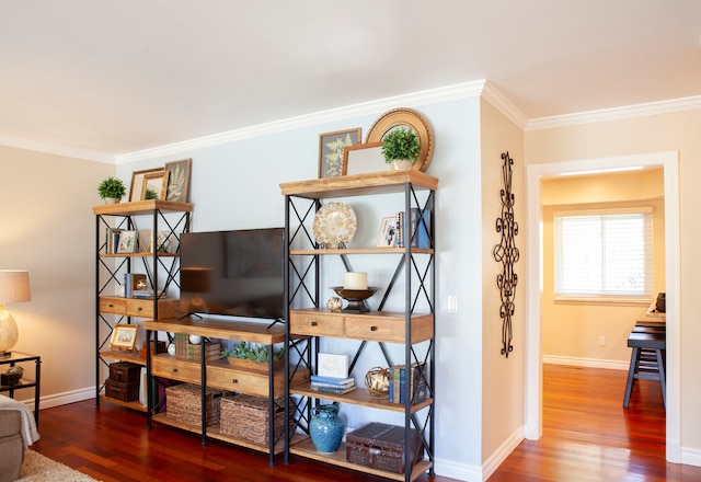 sitting room featuring crown molding, wood finished floors, and baseboards