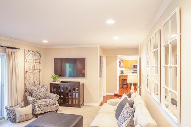 living area featuring ornamental molding, recessed lighting, baseboards, and carpet