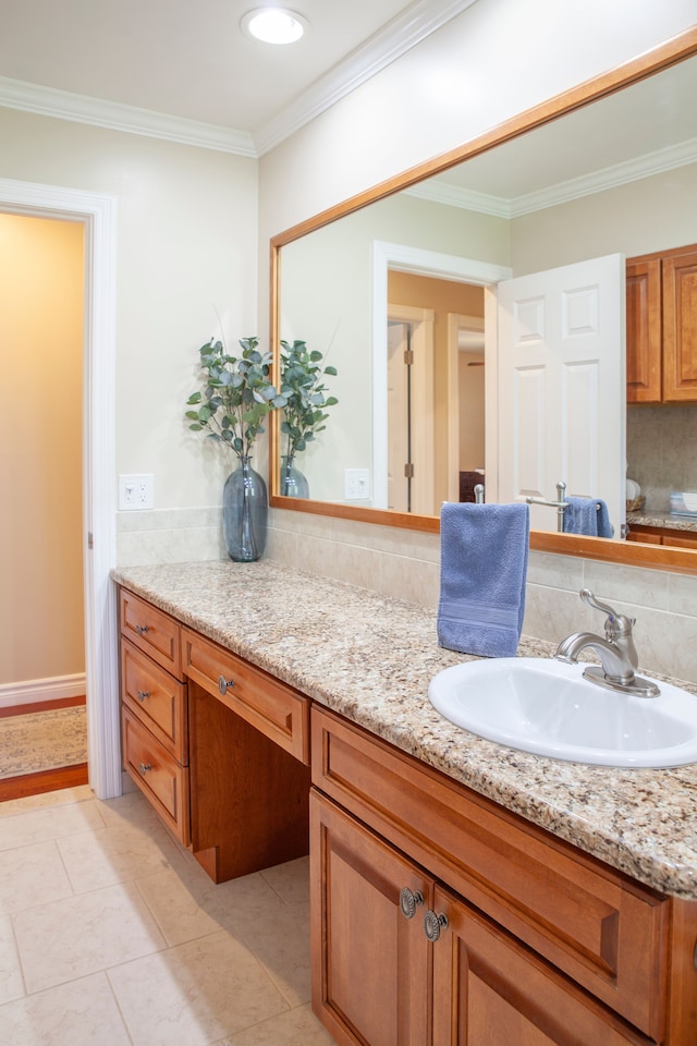 bathroom featuring vanity, tasteful backsplash, crown molding, and tile patterned floors