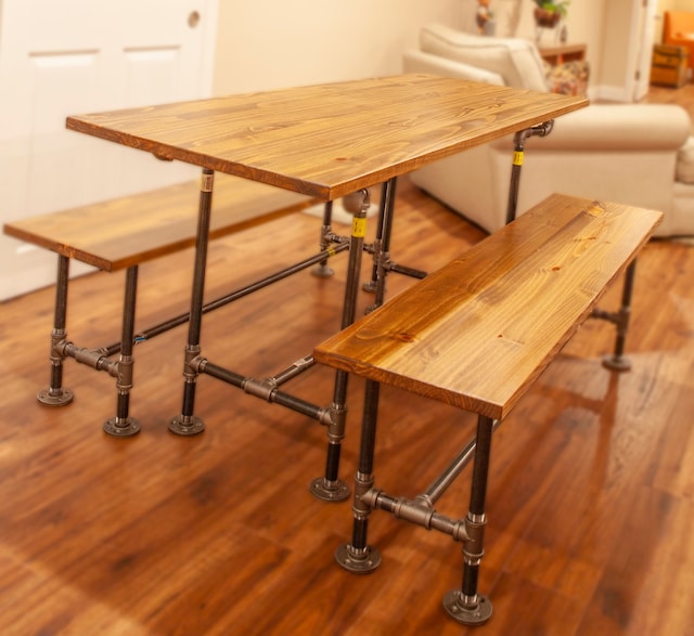dining area with wood finished floors