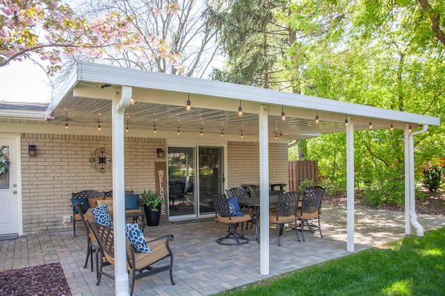 view of patio / terrace featuring a ceiling fan and fence