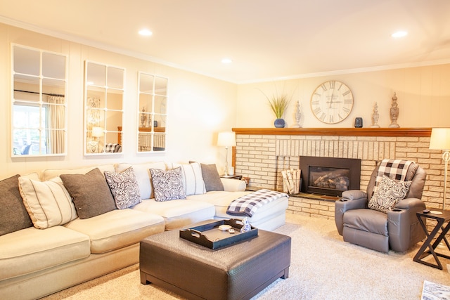 carpeted living area with crown molding, recessed lighting, and a fireplace