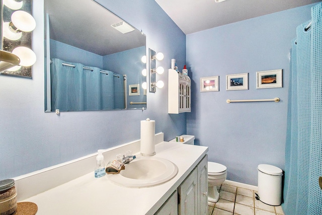 bathroom with tile patterned flooring, toilet, curtained shower, and vanity