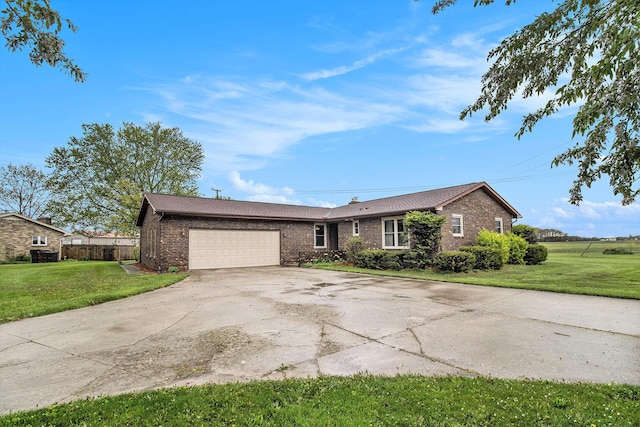 ranch-style house with brick siding, a garage, and driveway