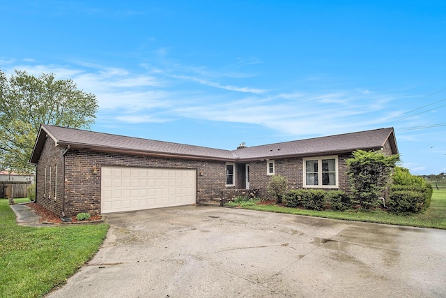 ranch-style home featuring brick siding, driveway, and a garage