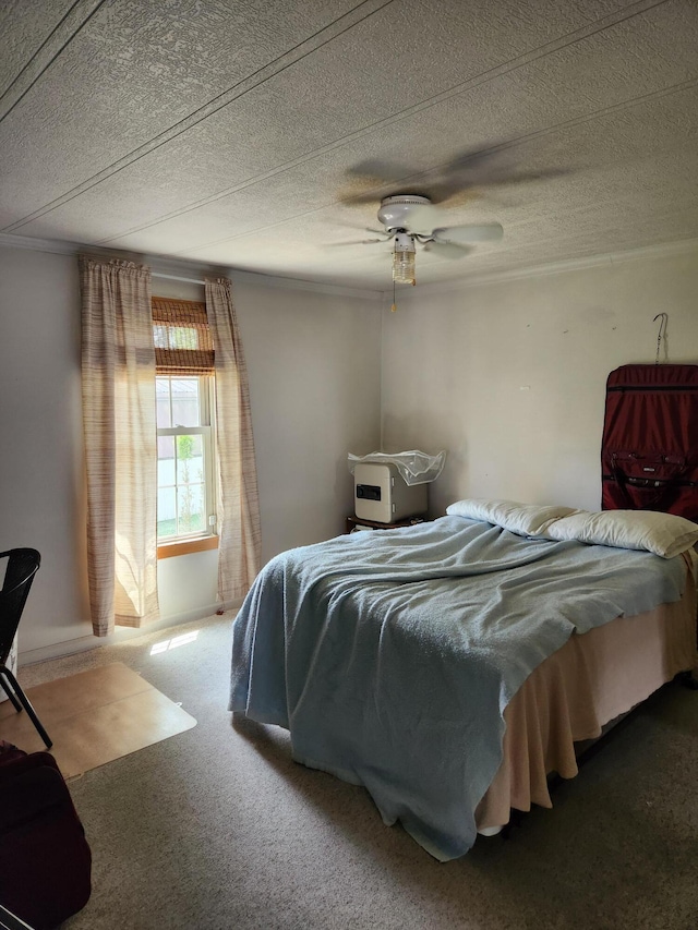 bedroom featuring carpet floors, ceiling fan, and ornamental molding
