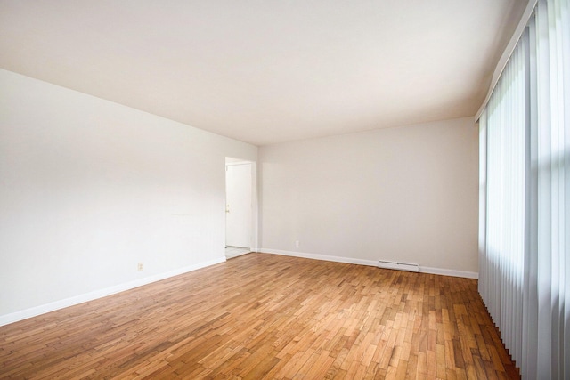 2 Fort St, Niles, MI 49120 - empty room featuring light wood finished floors, baseboards, and baseboard heating