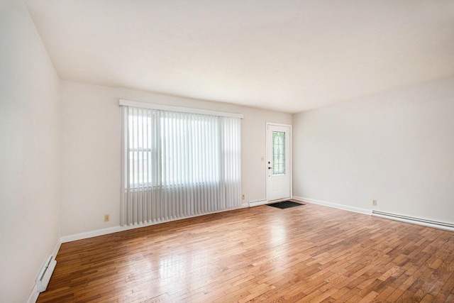 2 Fort St, Niles, MI 49120 - empty room featuring hardwood / wood-style floors, baseboards, and baseboard heating