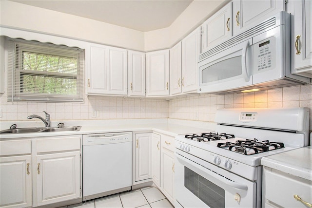 2 Fort St, Niles, MI 49120 - kitchen with white appliances, a sink, light countertops, and white cabinetry