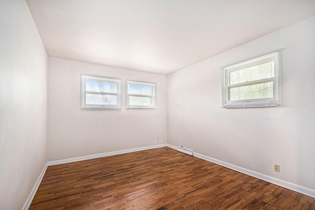 2 Fort St, Niles, MI 49120 - unfurnished room with wood finished floors, baseboards, and a baseboard radiator