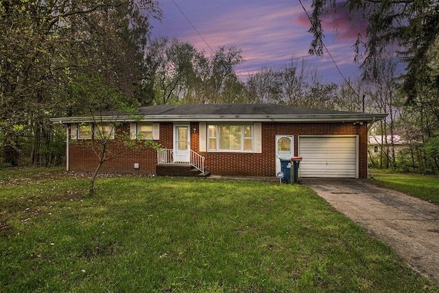 2 Fort St, Niles, MI 49120 - single story home with a garage, brick siding, concrete driveway, and a yard