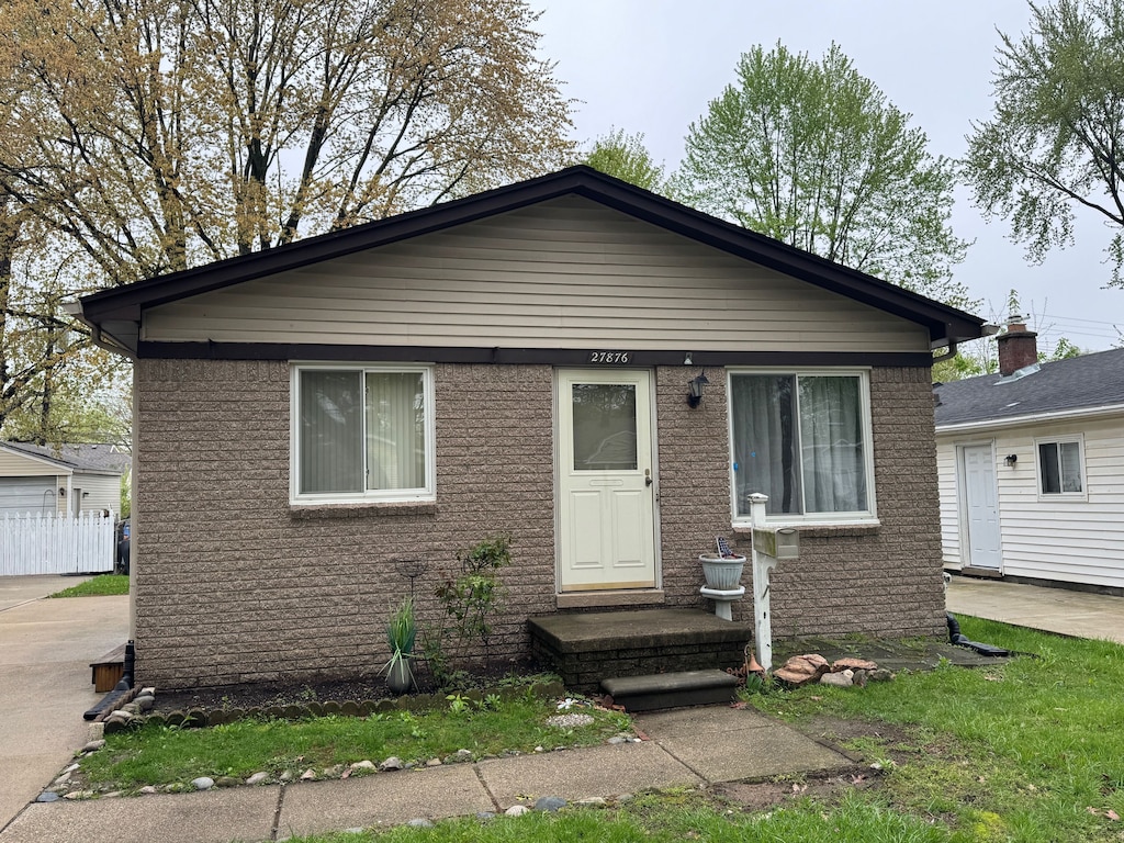 27876 Hampden St, Madison Heights, MI 48071 - bungalow-style home featuring brick siding and fence