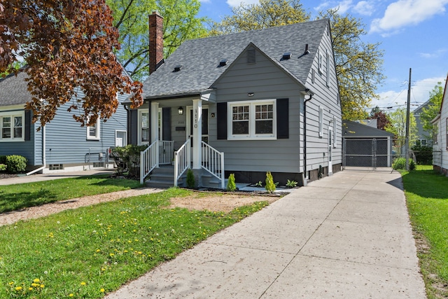 3110 Ellwood Ave, Berkley, MI 48072 - bungalow featuring a front yard, a chimney, roof with shingles, and a garage