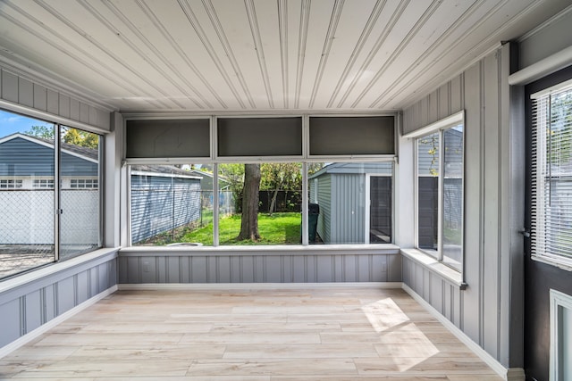 unfurnished sunroom featuring healthy amount of natural light