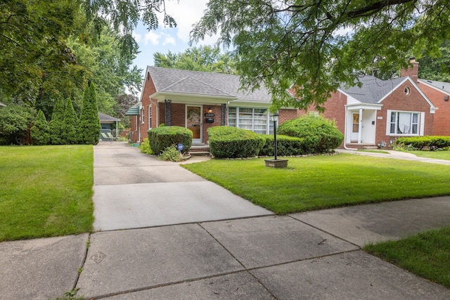 bungalow featuring brick siding, a front lawn, and a shingled roof