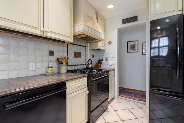 kitchen with black appliances, custom exhaust hood, cream cabinetry, decorative backsplash, and recessed lighting