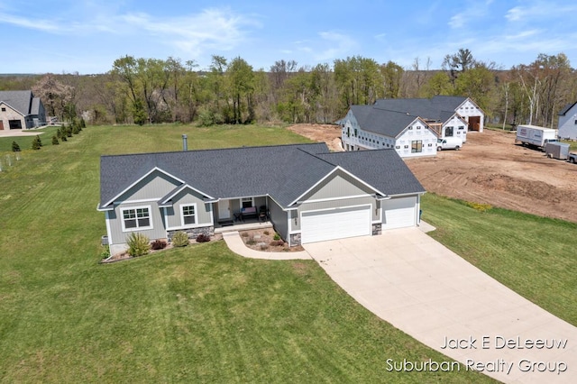 12840 Ridgedale Dr, Allendale, MI 49401 - ranch-style house featuring a garage, concrete driveway, a front lawn, and a shingled roof