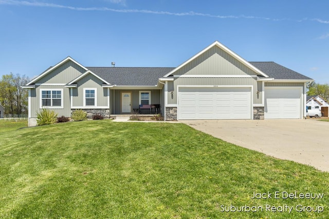 12840 Ridgedale Dr, Allendale, MI 49401 - craftsman inspired home with concrete driveway, a garage, stone siding, and a front yard