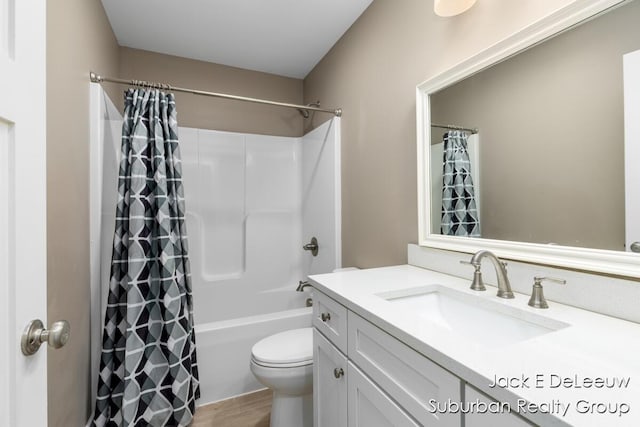 12840 Ridgedale Dr, Allendale, MI 49401 - full bath with toilet, vanity, shower / bath combination with curtain, and wood finished floors