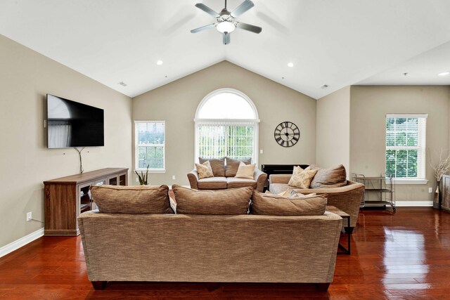 living area with plenty of natural light, a ceiling fan, dark wood-style floors, lofted ceiling, and recessed lighting