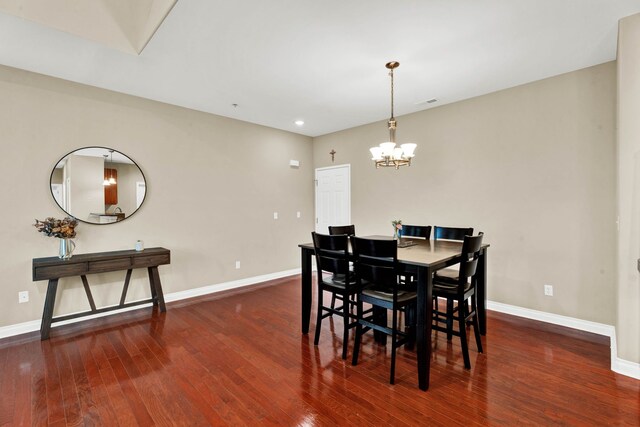 dining area featuring baseboards, a chandelier, hardwood / wood-style floors, and recessed lighting