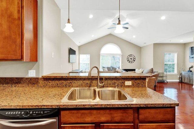 kitchen featuring a sink, stainless steel dishwasher, open floor plan, healthy amount of natural light, and lofted ceiling