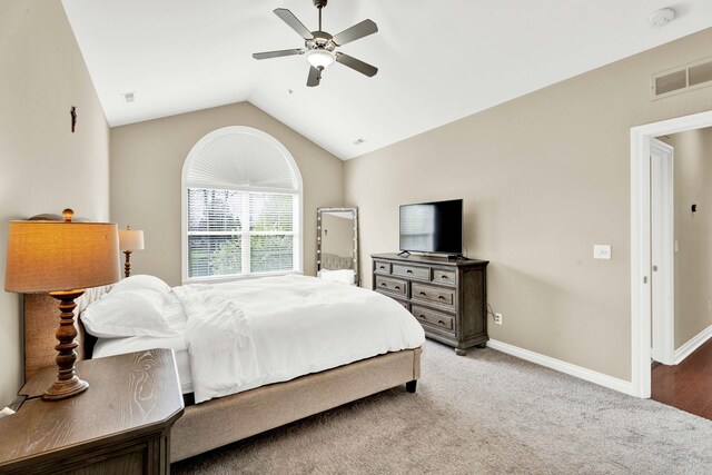 bedroom with lofted ceiling, baseboards, ceiling fan, and carpet floors