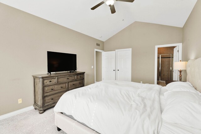 bedroom with light carpet, baseboards, a ceiling fan, high vaulted ceiling, and ensuite bathroom