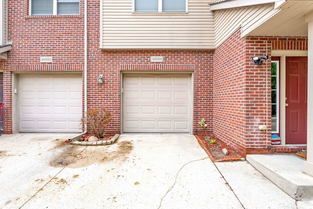 garage featuring driveway