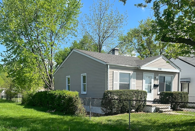 11389 Hupp Ave, Warren, MI 48089 - view of front of home featuring a chimney and roof with shingles