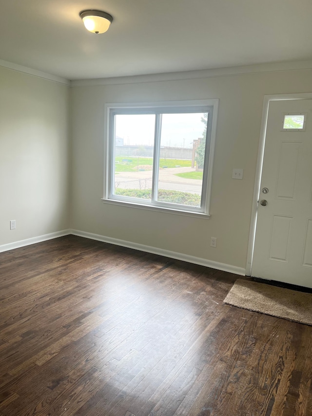 11389 Hupp Ave, Warren, MI 48089 - entryway with ornamental molding, dark wood-style floors, and baseboards