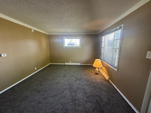 carpeted spare room with a textured ceiling and baseboards
