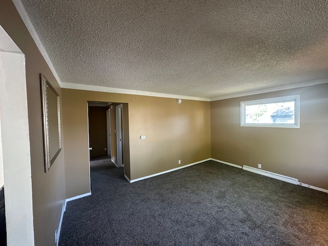 empty room with baseboard heating, dark carpet, a textured ceiling, and baseboards