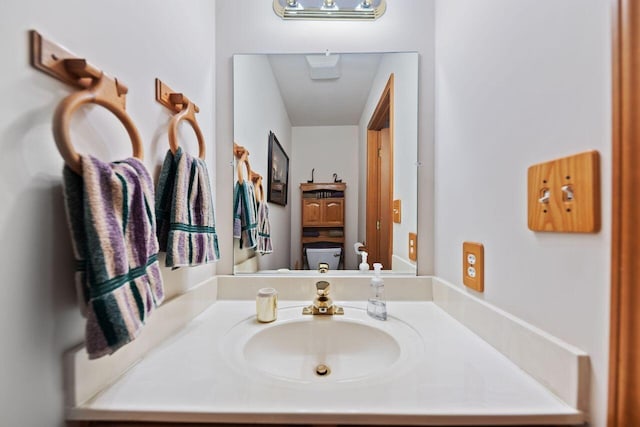 bathroom with toilet and vanity