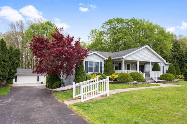 view of front of property with covered porch and a front lawn