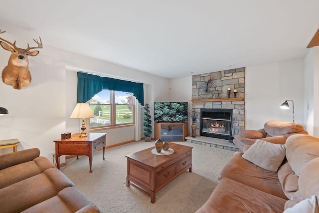 living room with carpet flooring, a fireplace, and baseboards