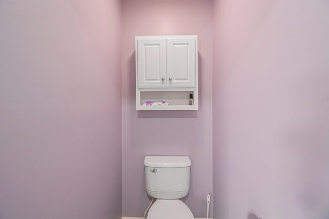 4261 Merriman Loop, Howell, MI 48843 - bathroom featuring toilet and baseboards