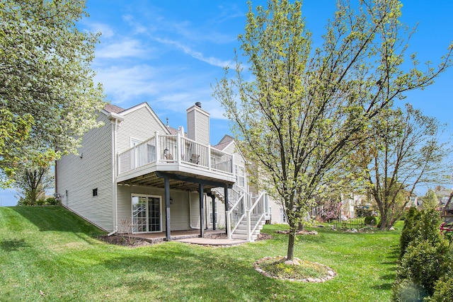 4261 Merriman Loop, Howell, MI 48843 - rear view of property featuring a deck, a yard, a chimney, and stairs