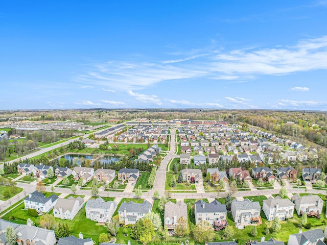 4261 Merriman Loop, Howell, MI 48843 - aerial overview of property's location with nearby suburban area and a nearby body of water